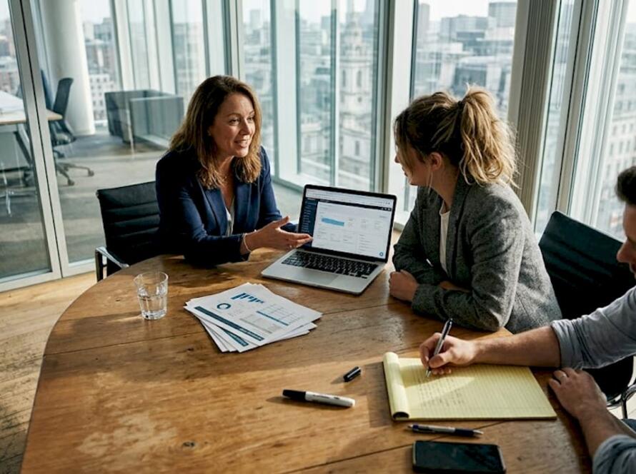 Team reviews sales report in conference room