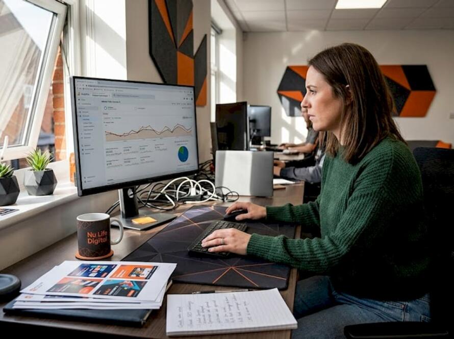 Marketer reviewing ad targeting analytics at desk