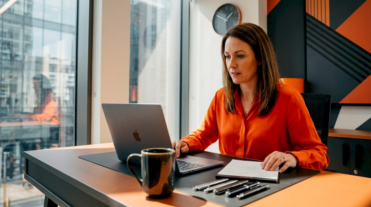 Business owner reviewing website notes in home office